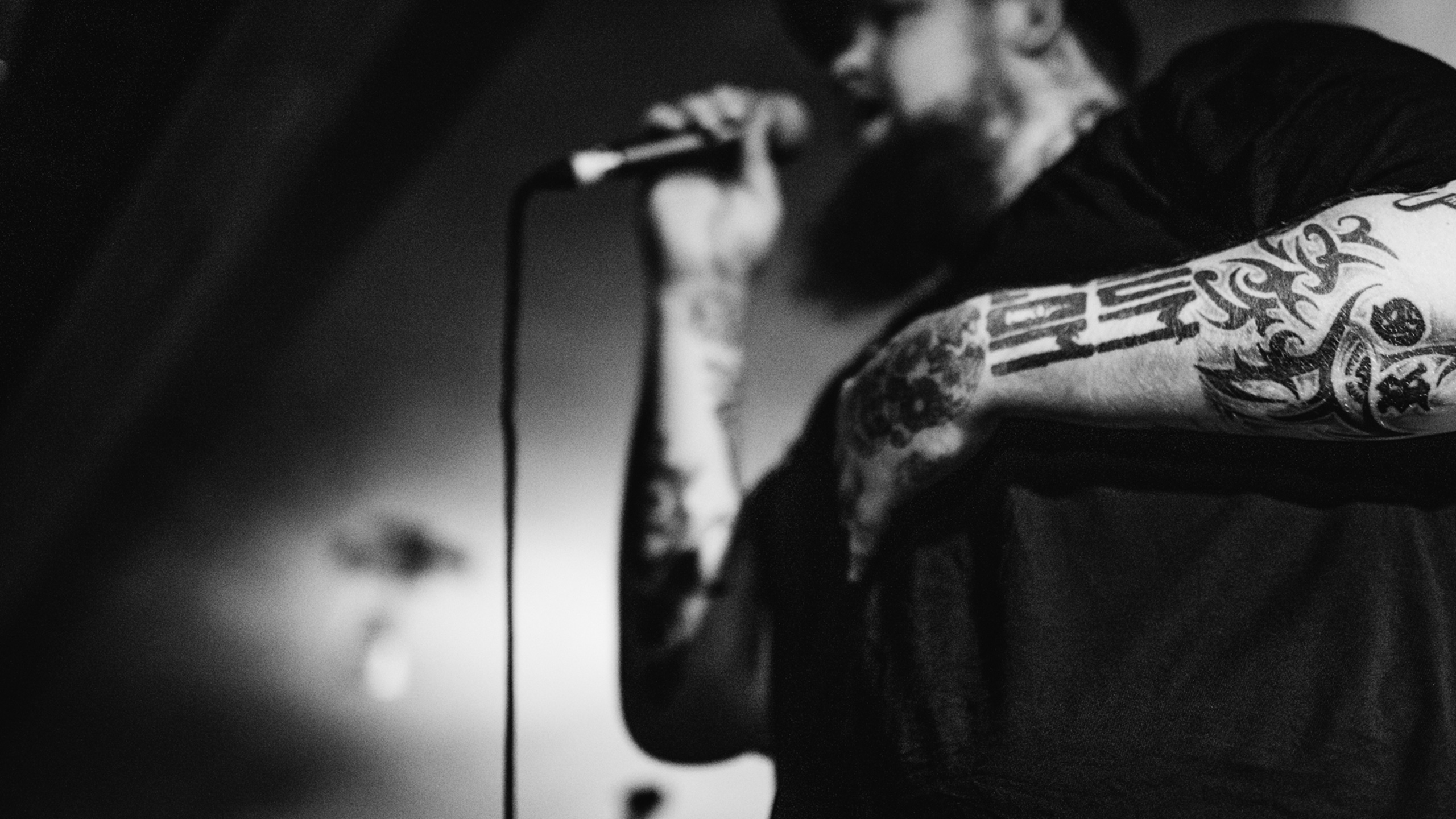 Close up of Rag'n' Bone Man's tattooed arms as he sings at PRS for Music Presents