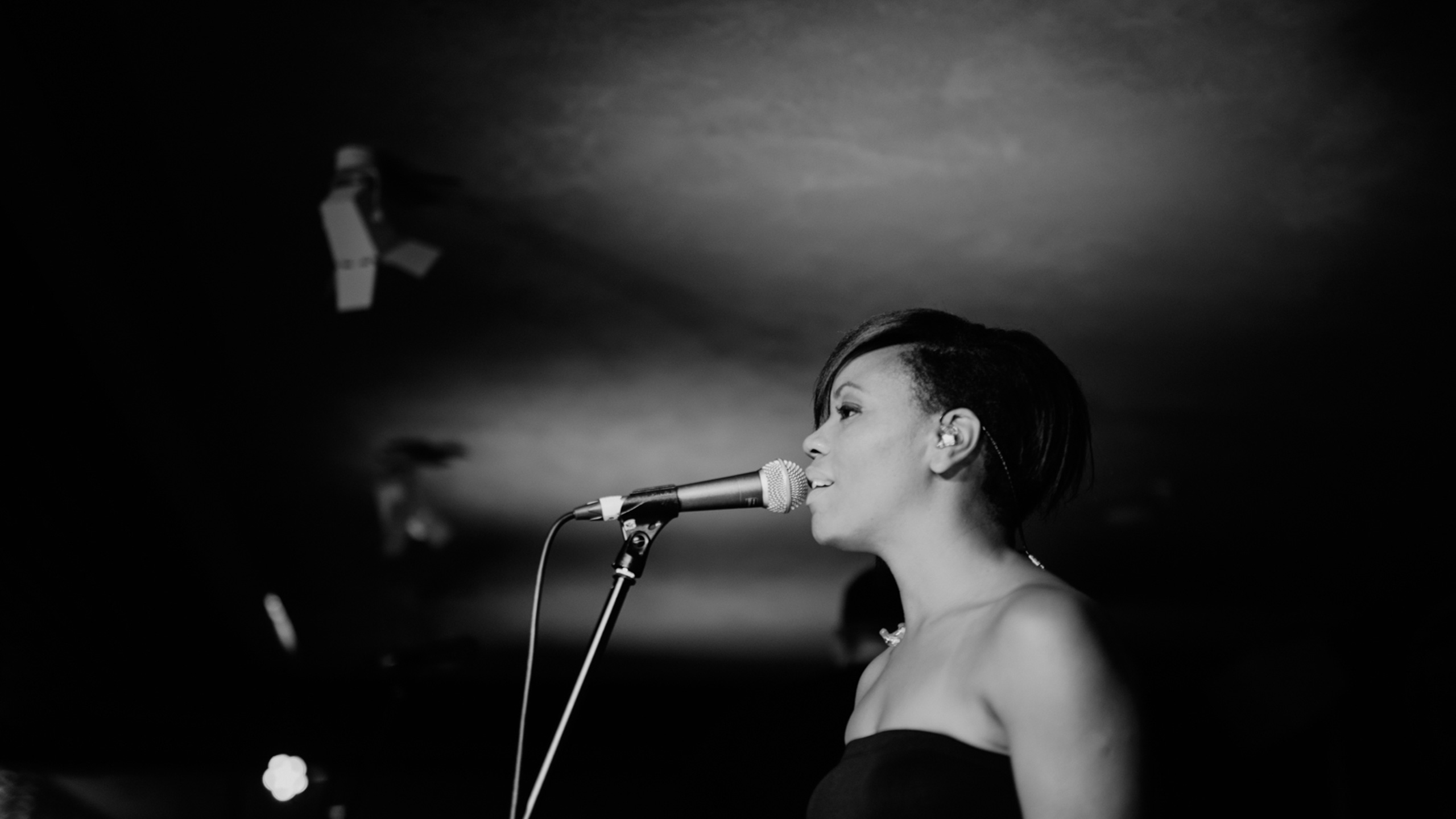 A backing singer sings at PRS for Music Presents