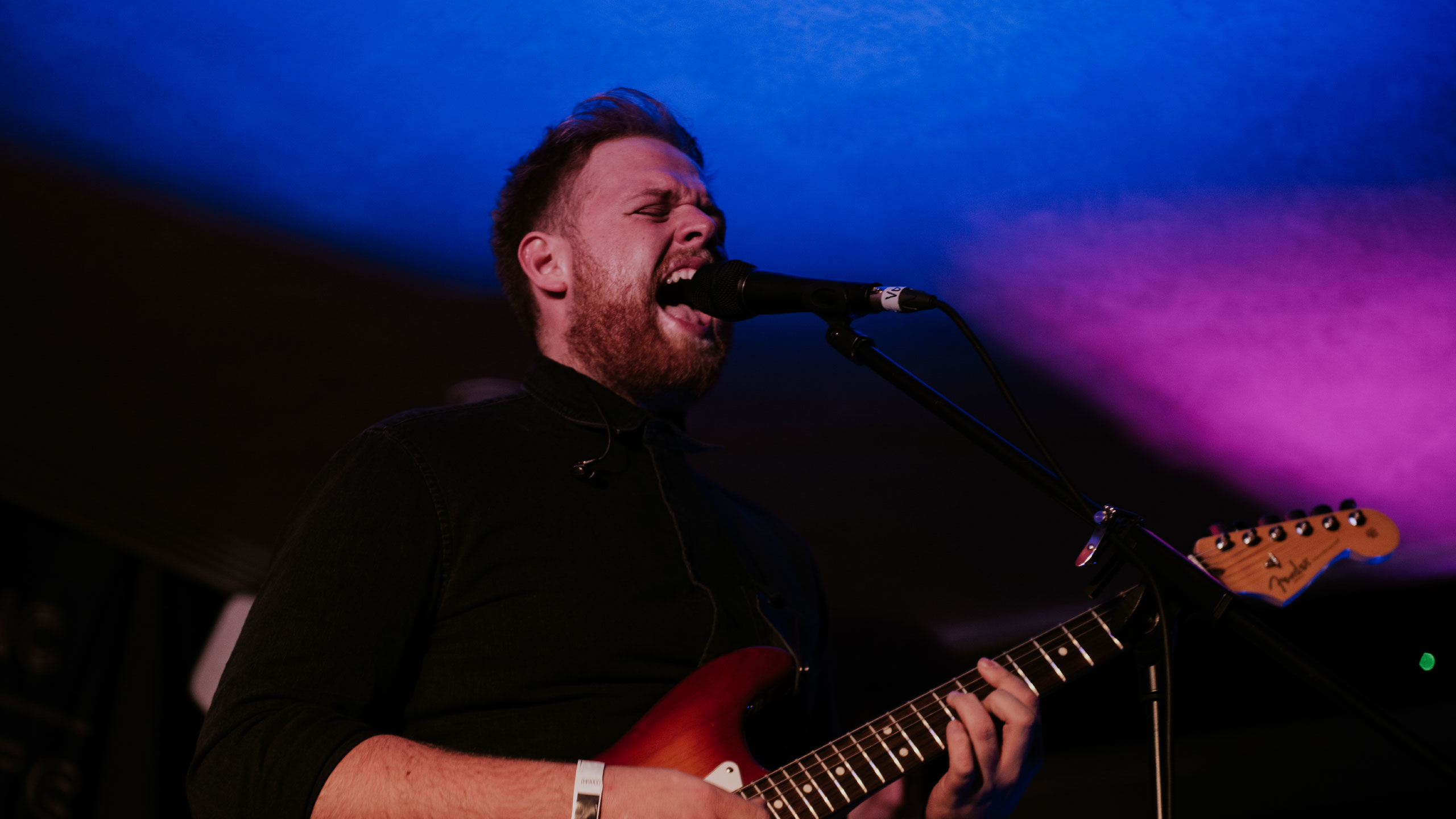 Tom Walker singing and playing guitar at PRS for Music Presents 2nd Birthday