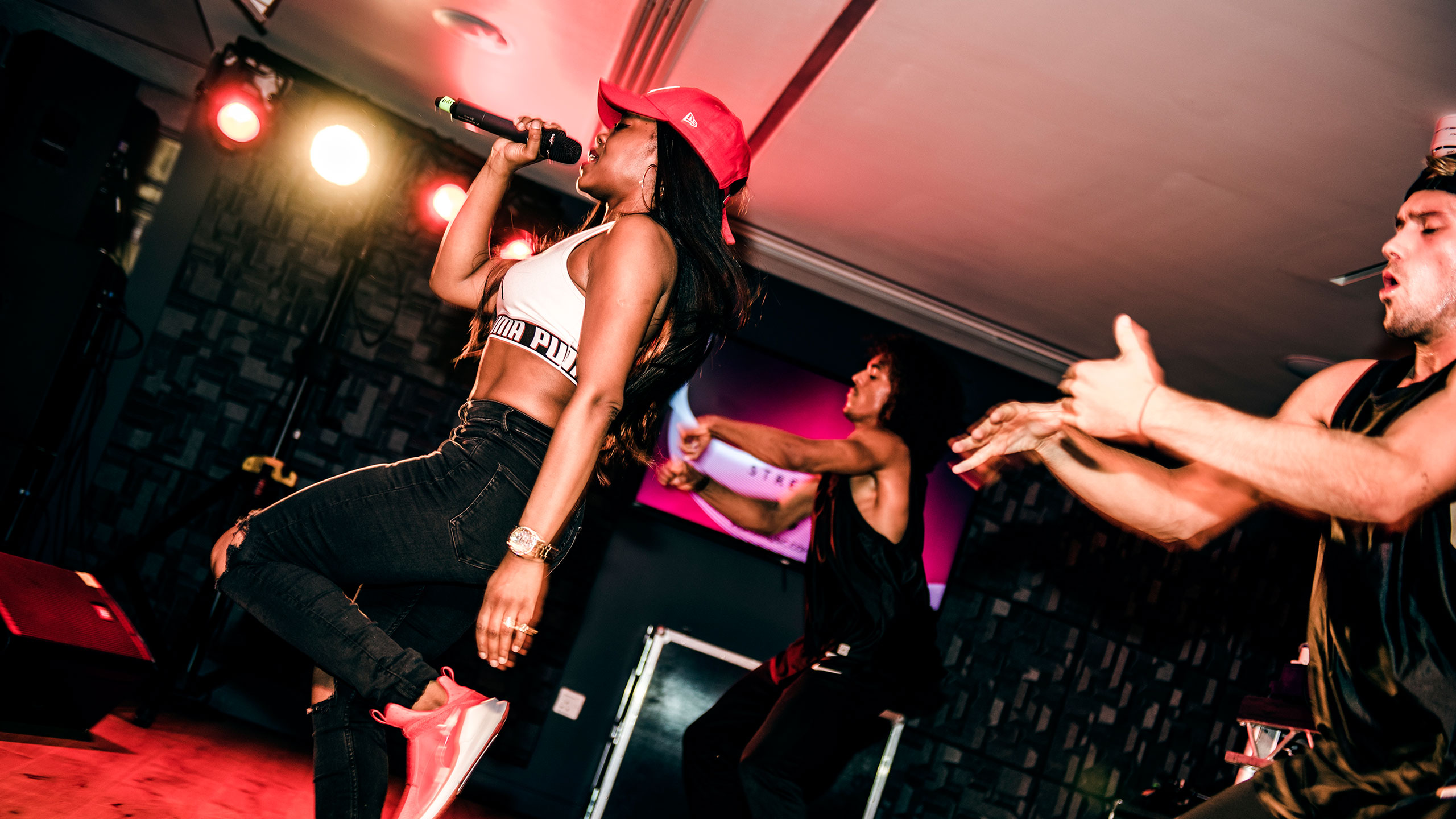 Lady Leshurr performing with two backing dancers at PRS for Music Presents