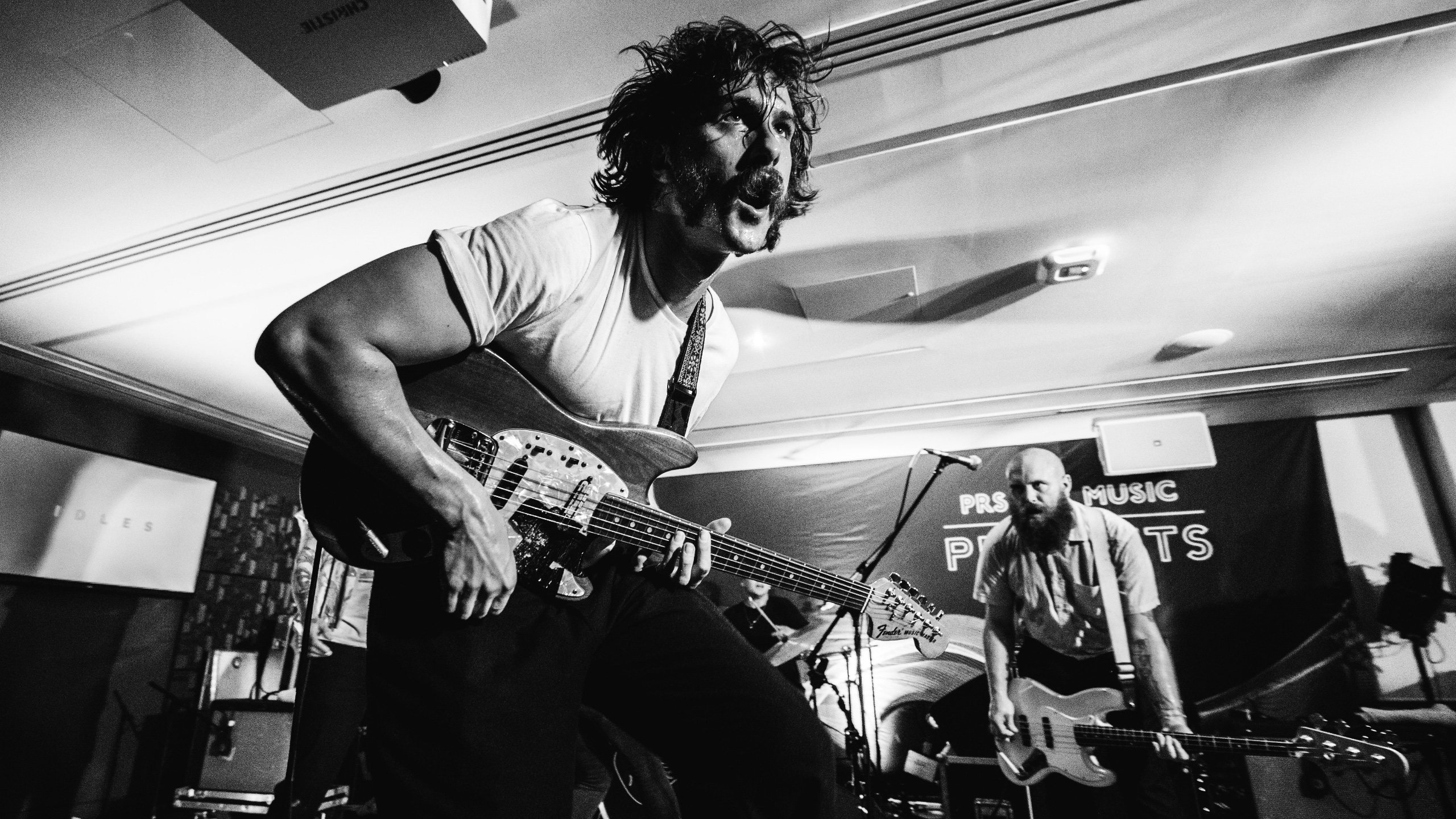 Idles guitarist and bassist performing at PRS for Music Presents