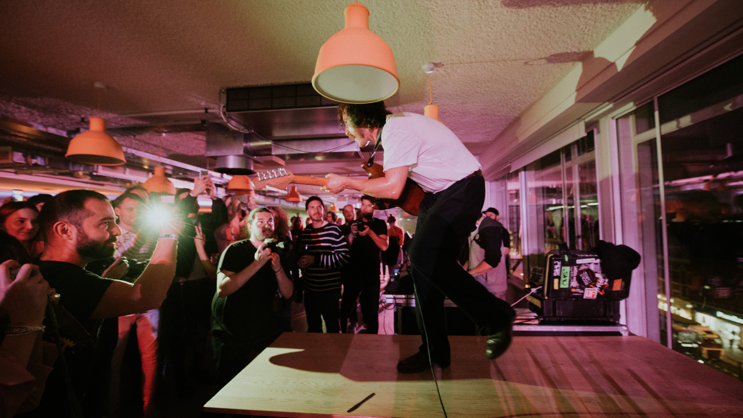 Idles guitarist on a high platform at PRS for Music Presents